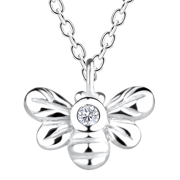 Close-up of the Ruby Folk Bee Necklace showing the natural diamond