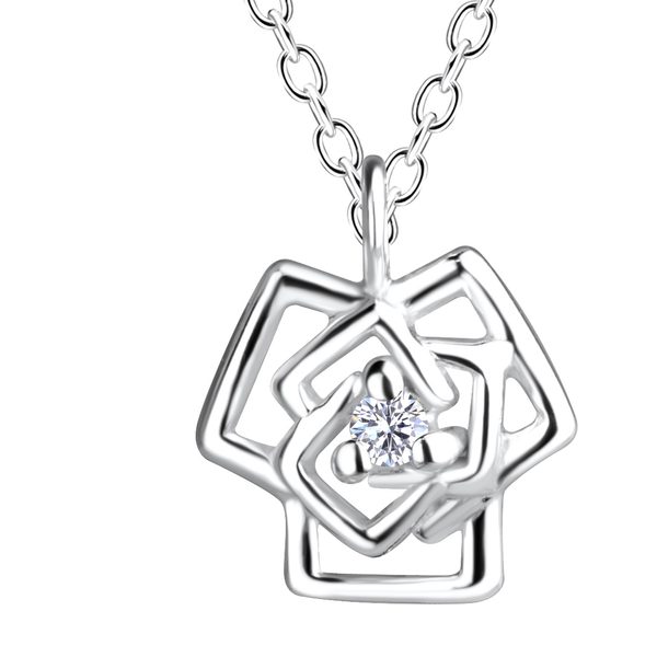 Close-up of the Ruby Folk Rose Necklace showing the natural diamond