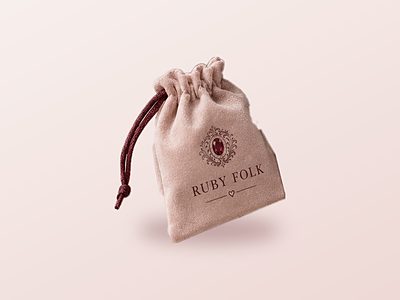 Blush velvet pouch with the Ruby Folk crest
